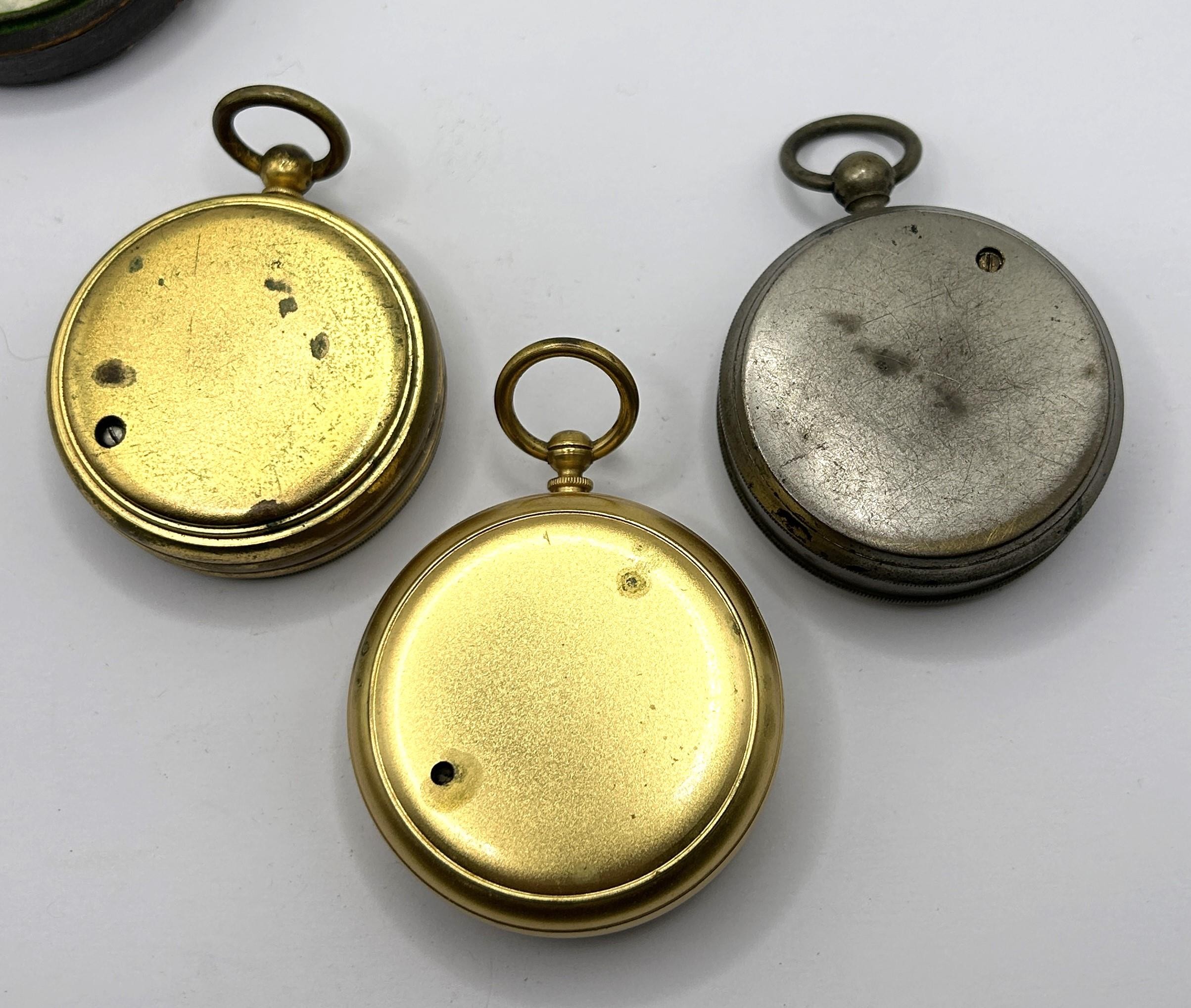 A pocket barometer, by Negretti & Zambra of London, No 18499, cased, another, cased, and another, - Image 5 of 5