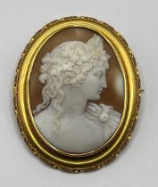 A 19th century cameo, carved a portrait, in a yellow metal mount, 6 x 4 cm slightly out of shape