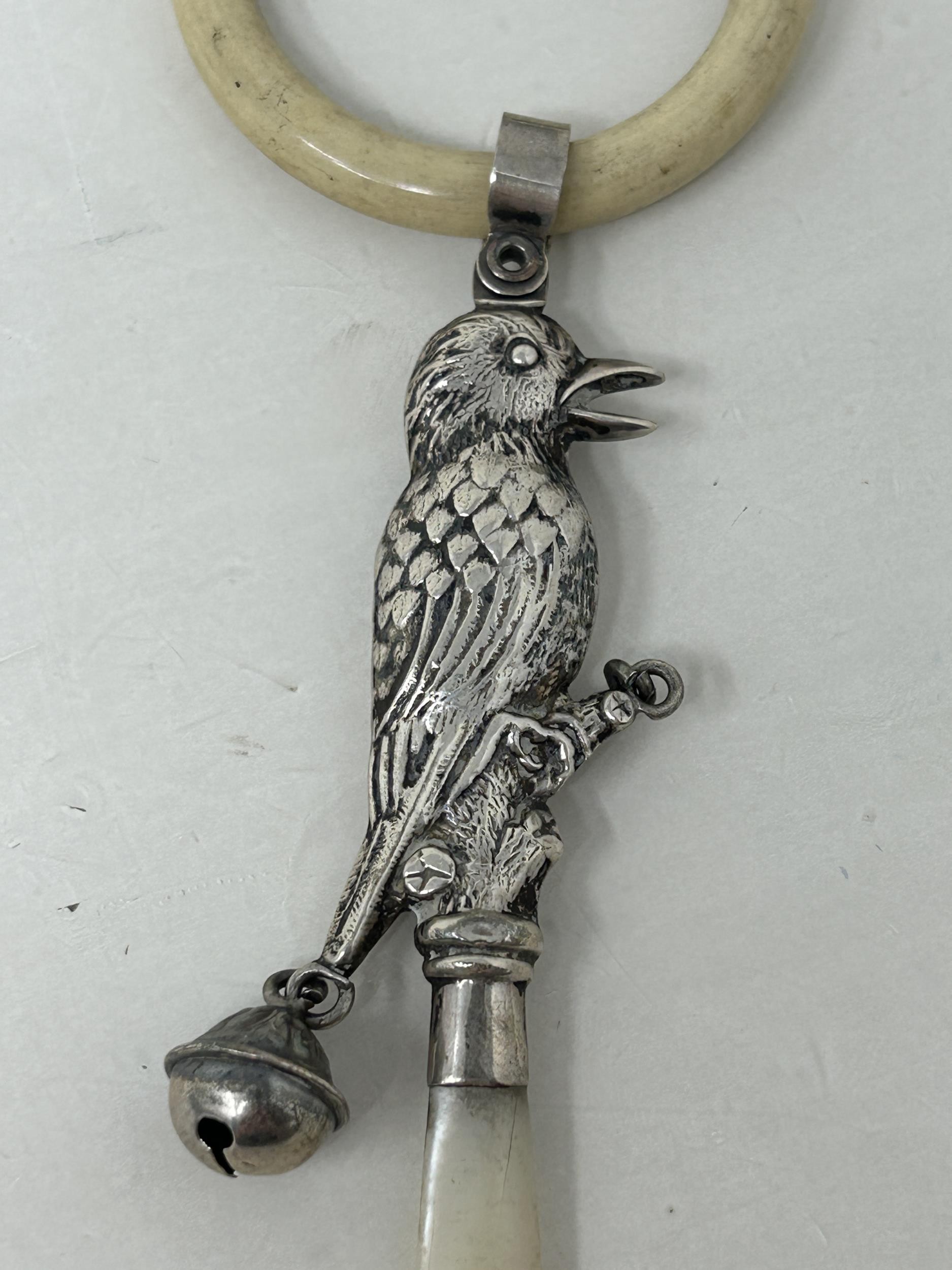 ***Withdrawn*** A silver and mother of pearl baby's rattle, in the form of a bird, Birmingham - Image 2 of 3