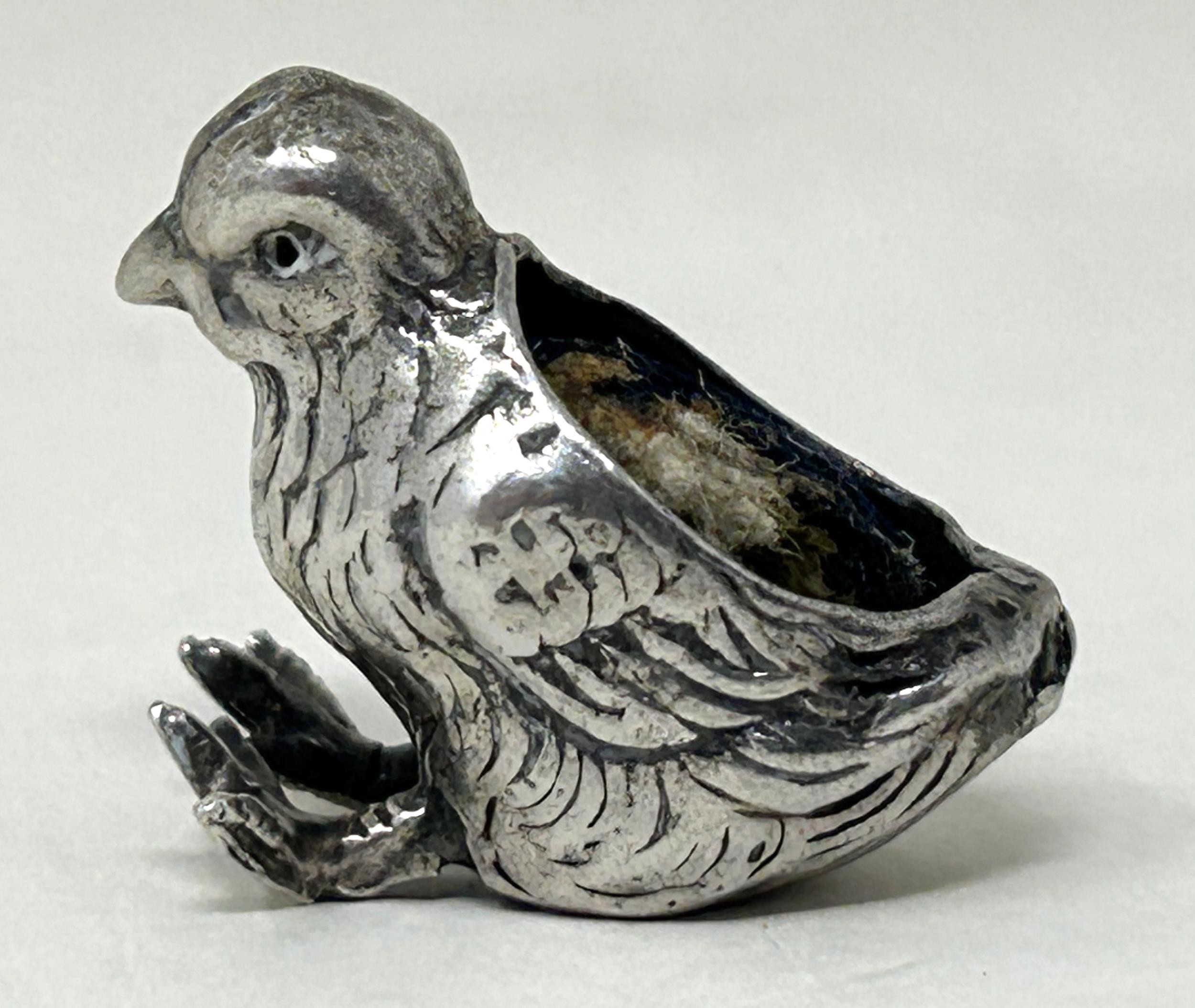 A silver coloured metal novelty pin cushion, in the form of a chick, 6.6 g, 2 cm wide