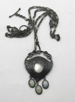 An Art Nouveau pewter and oval moonstone pendant, on a chain, with a receipt from Didier Antiques,