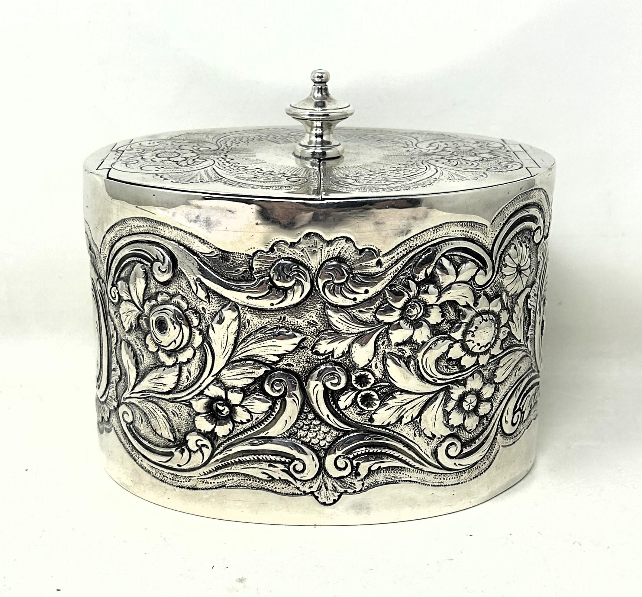 A George III silver oval caddy, London 1777, 13.1 ozt decoration probably later