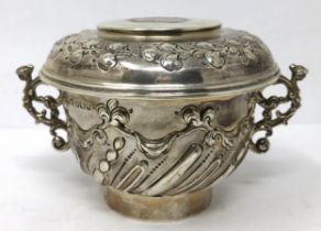 A silver two handled cup and cover, the cover inset with an Elizabeth I shilling, Sheffield 1900,