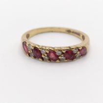 A 9ct gold, garnet and white stone ring, ring size K