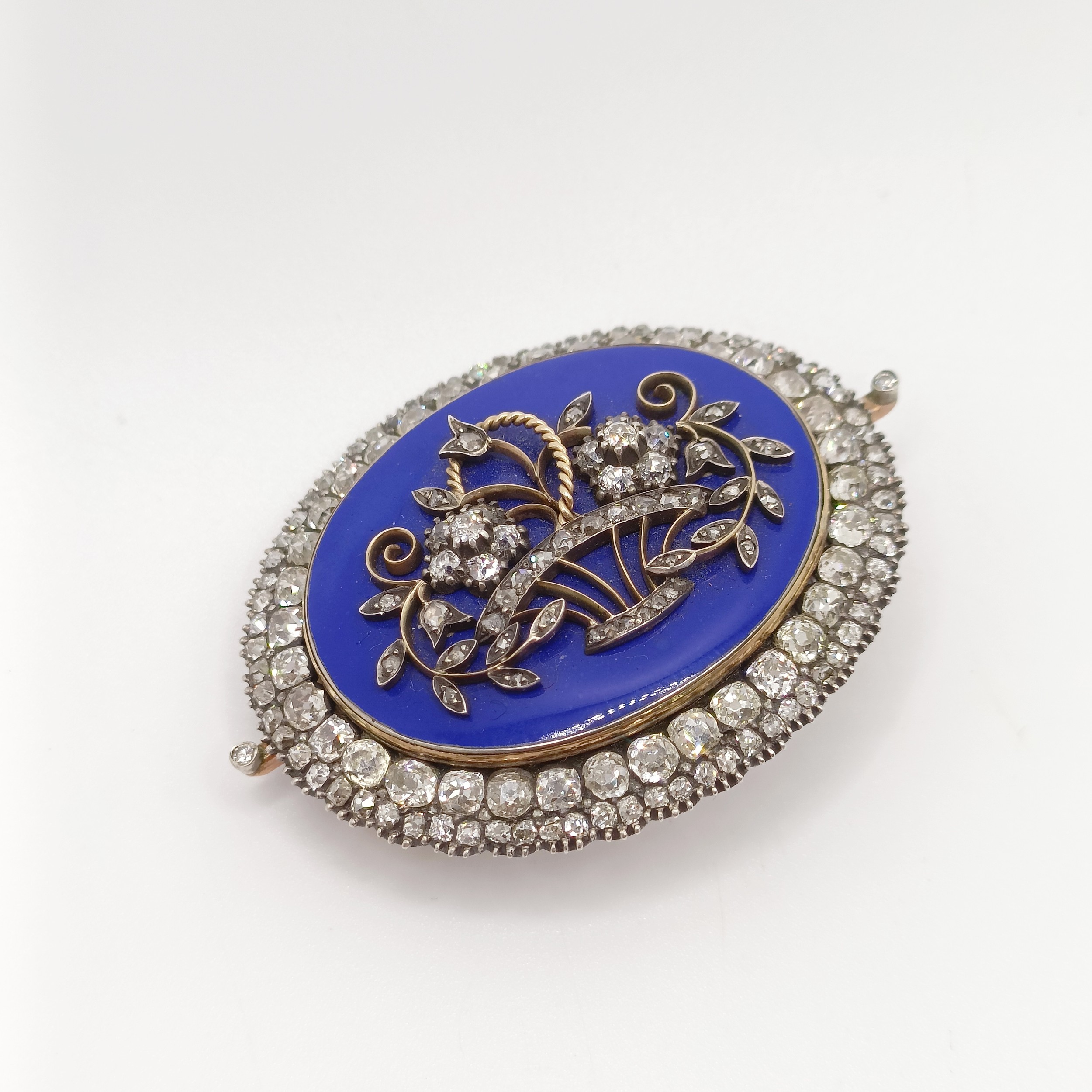 An early 19th French diamond, blue enamel, yellow and white metal oval brooch, decorated a basket of - Image 5 of 6
