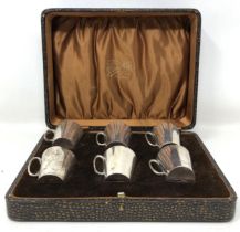 A set of six Indian silver coloured metal cups, cased Provenance: Sold on behalf of SNCBS