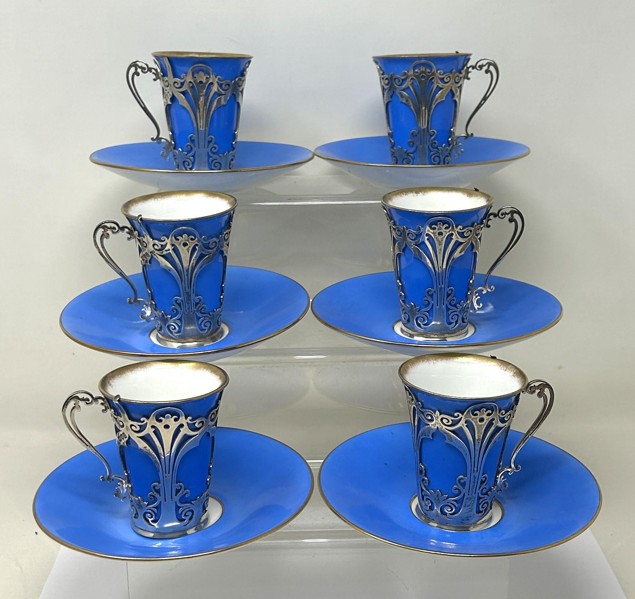 A set of six porcelain and silver mounted coffee cans, London 1906