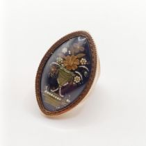 A 19th century gold and blue enamel mourning ring, decorated a vase of flowers, ring size P,