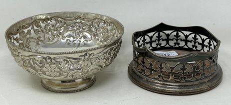 A silver coloured metal pierced bowl, and a silver plated bottle coaster (2) Bowl is stamped silver,