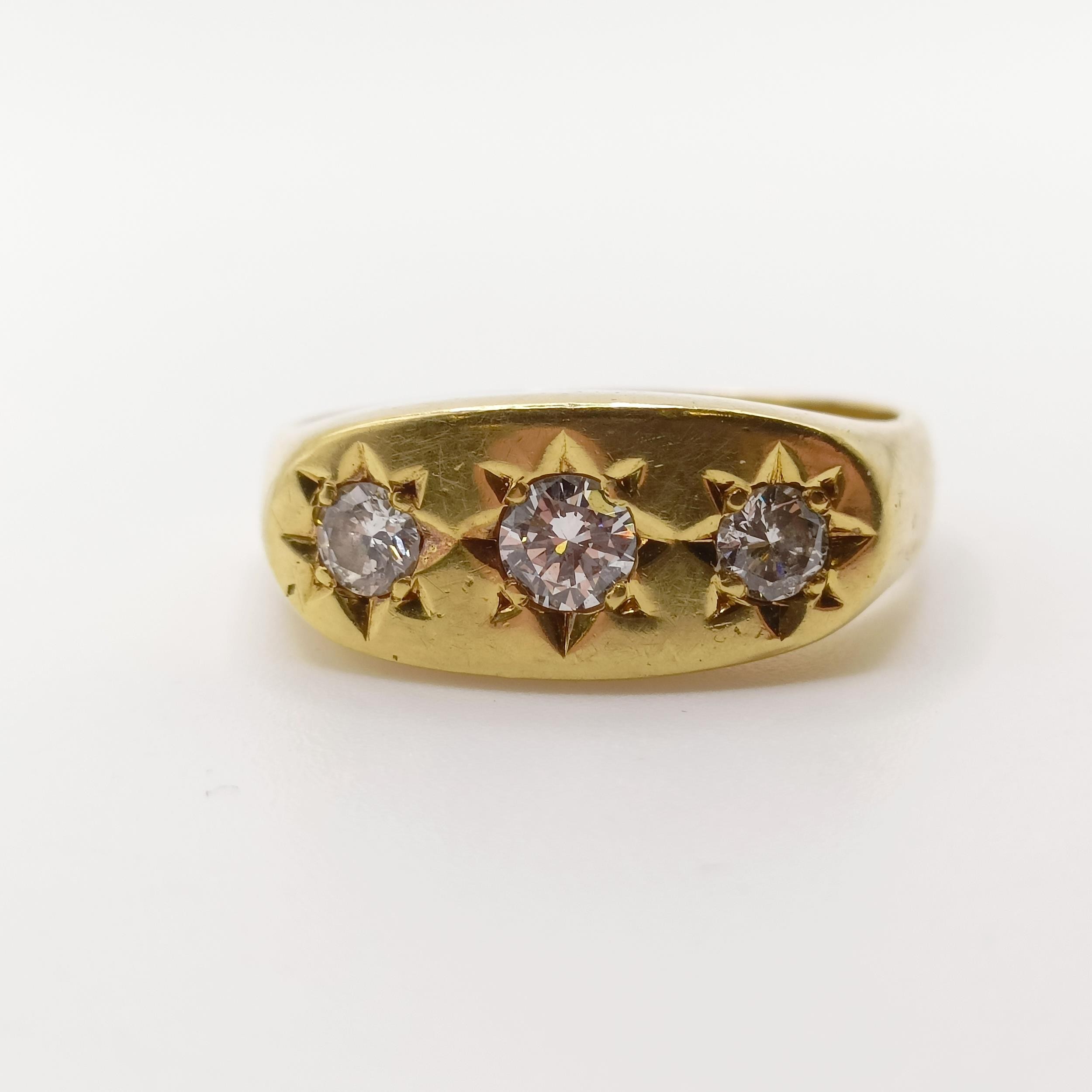 An 18ct gold three stone diamond gypsy set ring, ring size P 1/2 light ware due to use, no obvious - Image 2 of 5