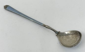 A Continental silver coloured metal, blue and white enamel spoon