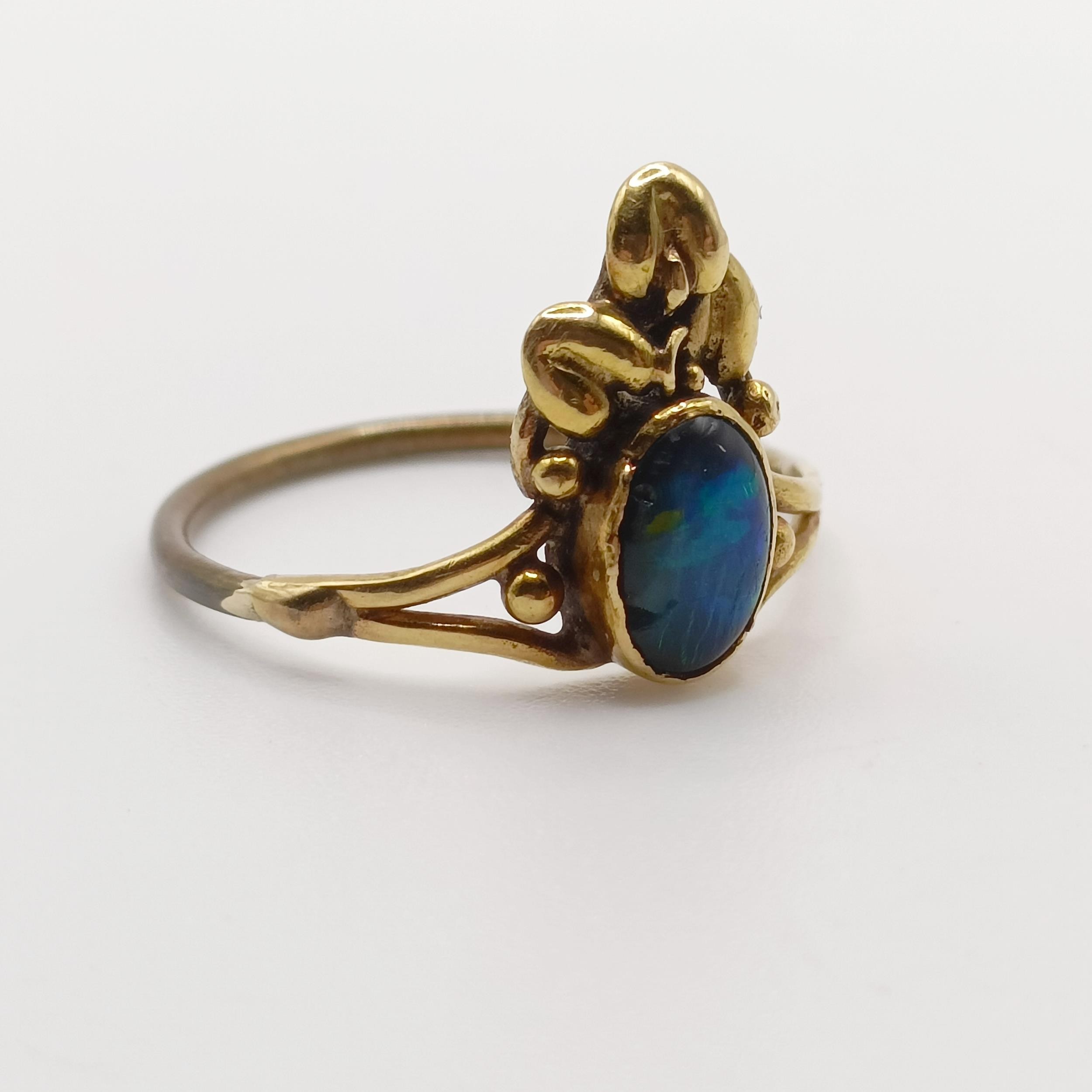 An Arts and Crafts yellow coloured metal and opal ring, by Jean Bassett, size J 1/2 Provenance: - Image 2 of 6