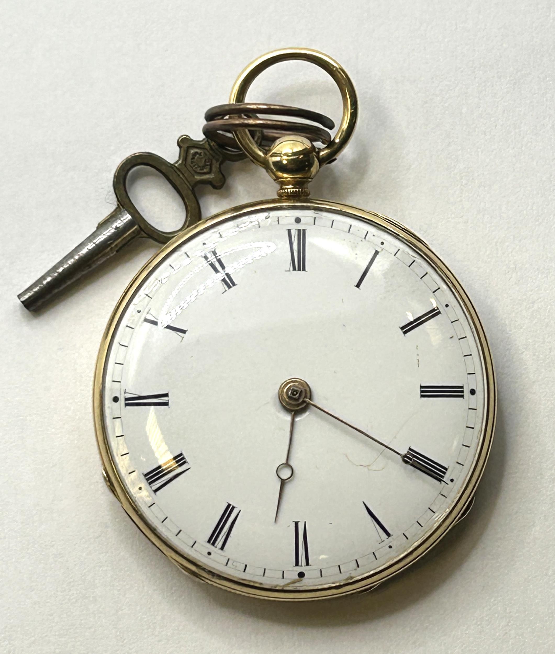 An 18ct gold open face pocket watch, the enamel dial with Roman numerals, the dust cap with engraved