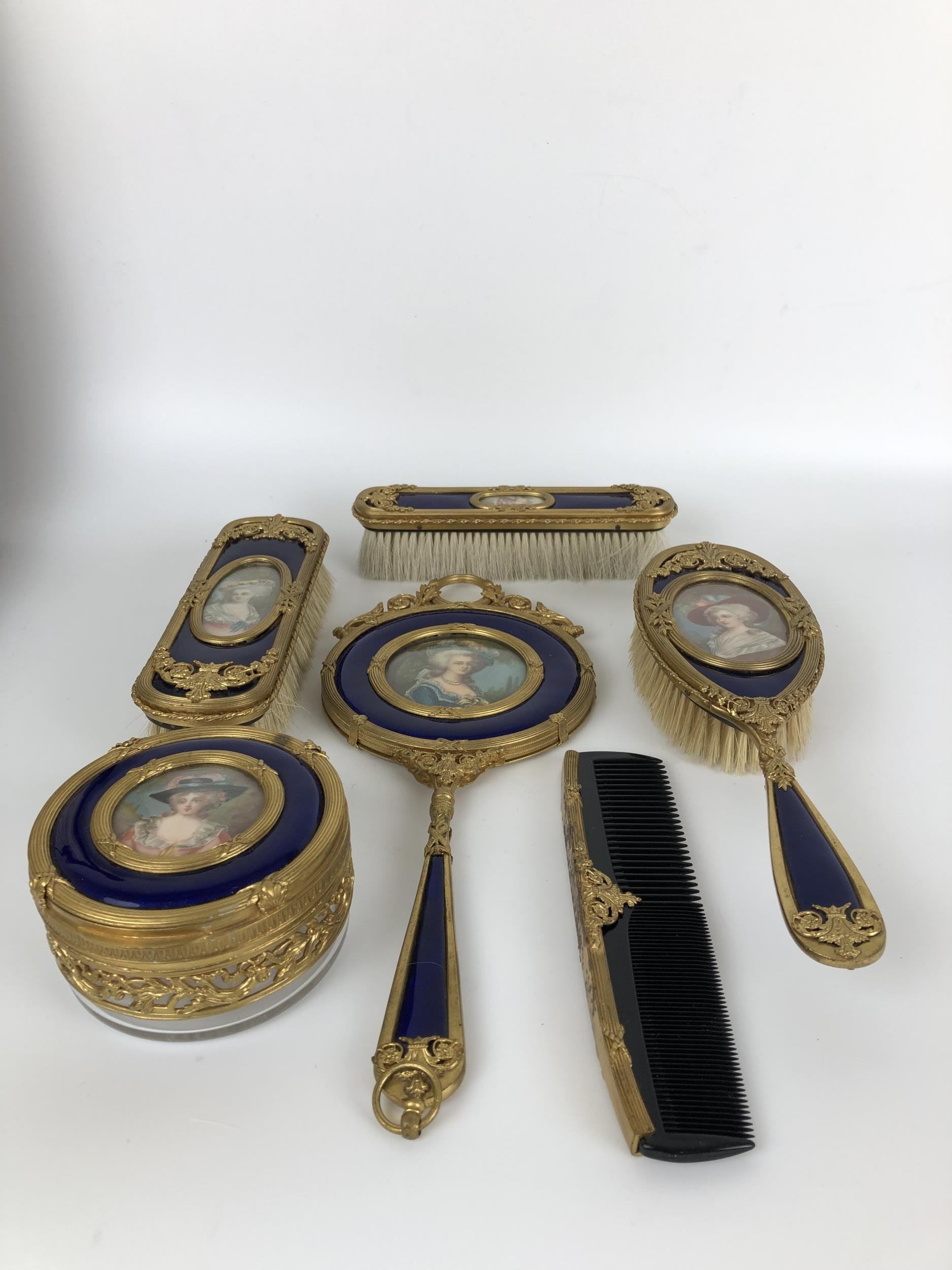 An impressive early 20th century gilt metal and blue enamel dressing table set, inset with - Image 9 of 10