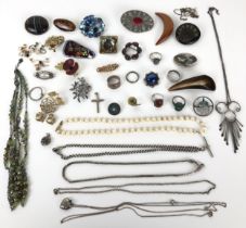 A silver coloured metal oval brooch, and assorted costume jewellery