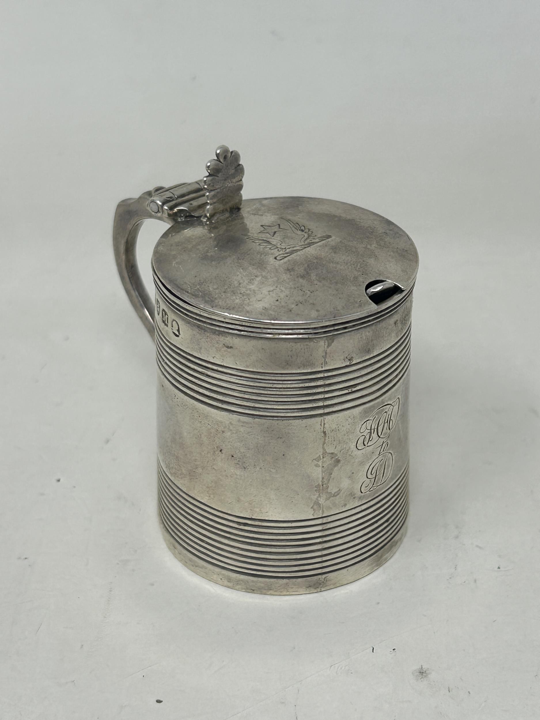 A George III silver mustard, in the form of a tankard, London 1807, 2.3 ozt, and an associated spoon