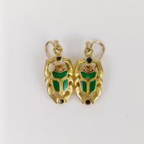 A pair of 18ct gold and green enamel earrings, in the form of scarab beetles