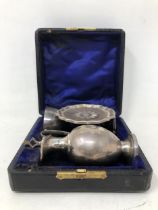 A Victorian silver communion set, comprising a chalice, ewer and stand, Birmingham 1885, all in 2.