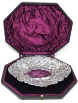 A Victorian silver oval bowl, embossed flowers, London 1886, 17.8 ozt, cased