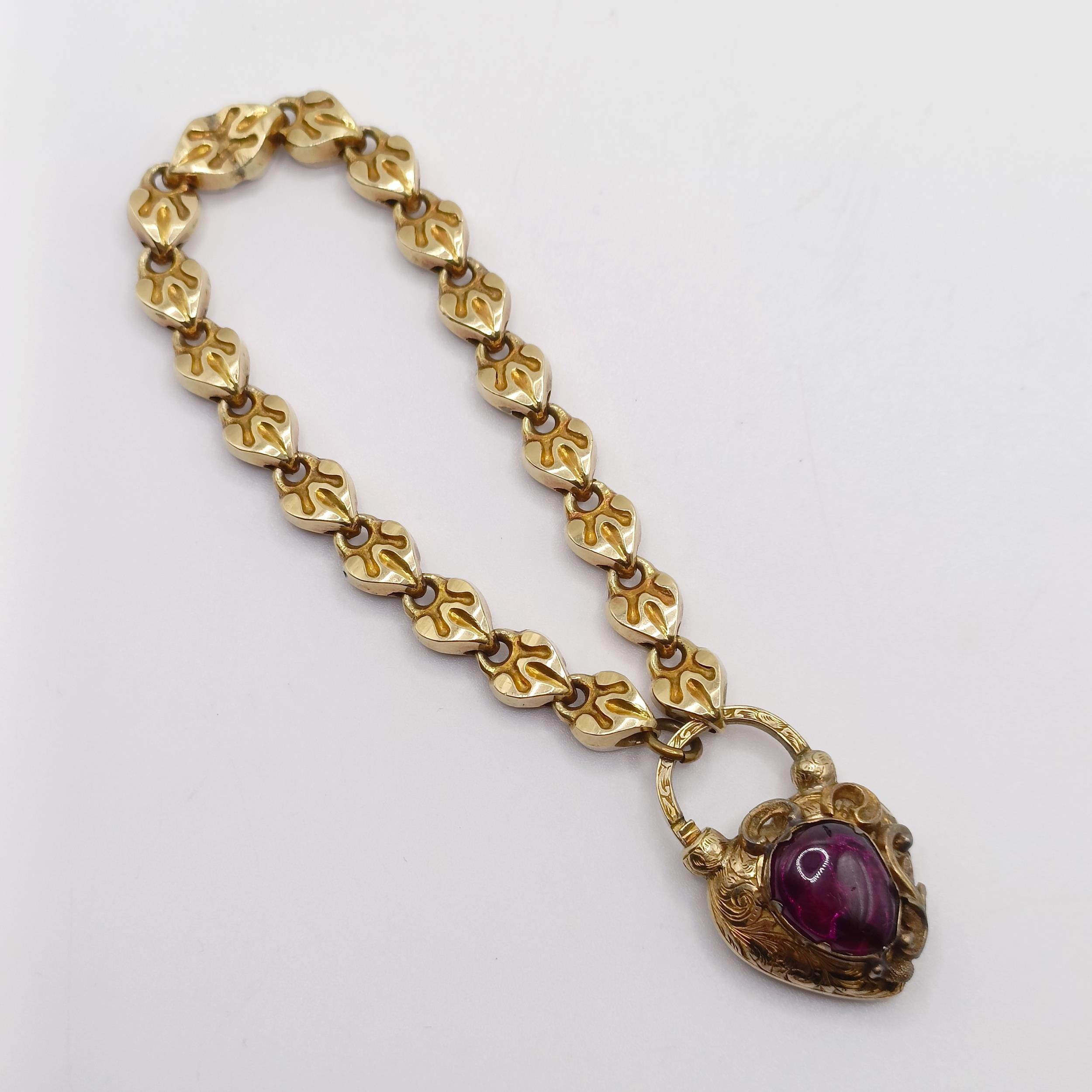 A late 19th/early 20th century yellow metal bracelet, with a padlock clasp, inset with a cabochon - Image 2 of 7