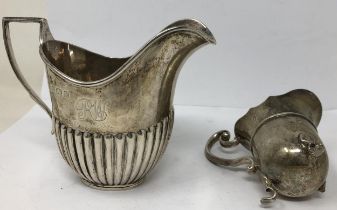 A George V silver cream jug, Birmingham 1922, and another smaller silver cream jug, 6.33 ozt (2)