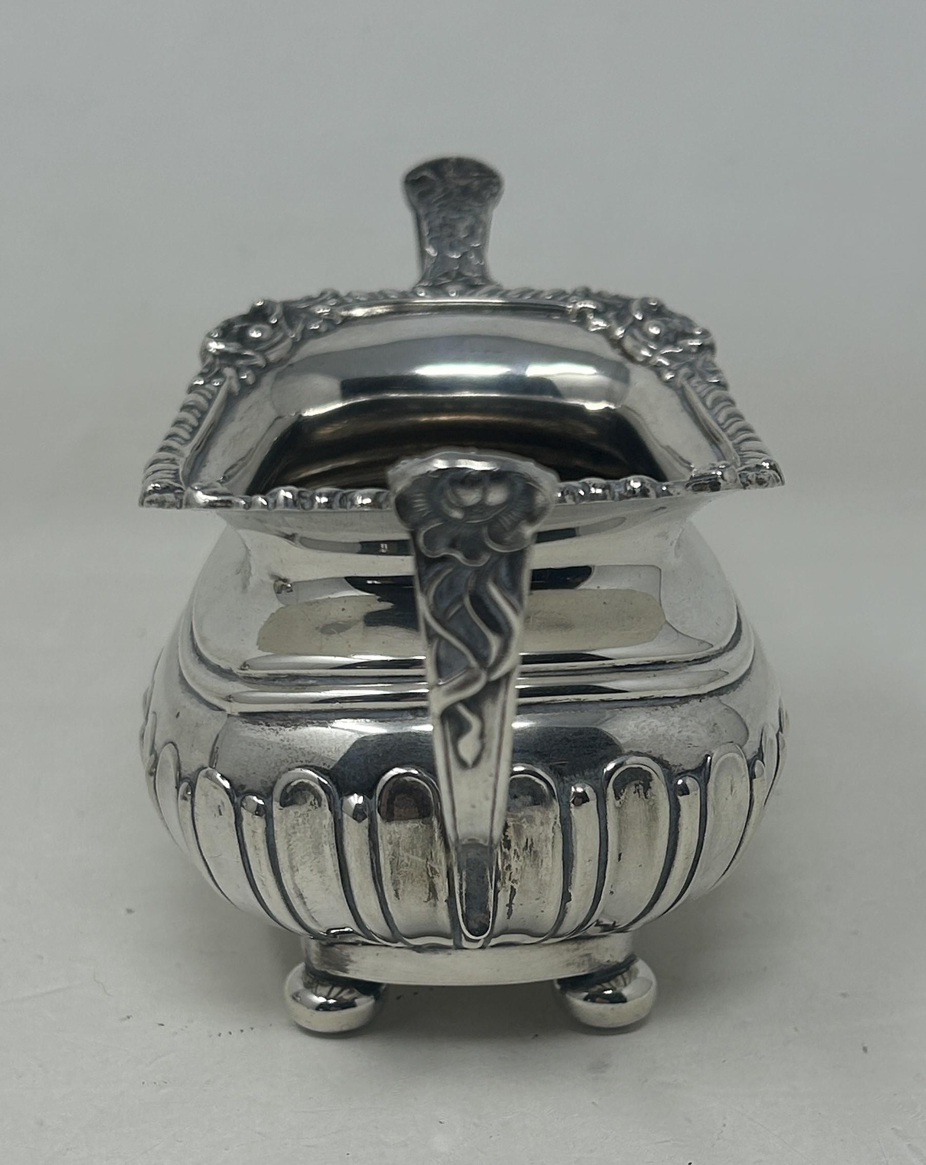 A George V silver bachelor teapot with an ebonised handle, and matching sugar bowl, London 1909, all - Bild 6 aus 11