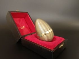 A silver gilt Easter egg, by Stuart Devlin, No 35, London 1979, 3.46 ozt, cased, with receipt no