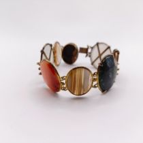 An early 20th century multi coloured stone and gilt metal bracelet
