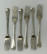 A pair of George III silver Old English pattern forks, London 1784, 13 ozt, and four other forks (6)