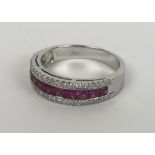 An 18ct white gold, three row ruby and diamond half eternity ring, square step-cut rubies 1.09ct R/C