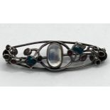 Attributed to Liberty, a pewter, moonstone and enamel brooch, believed to be by Jessie M King,