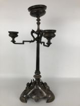 A Victorian silver candelabrum, lacking one branch, the base with griffin mounts, with a