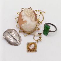 A silver gilt filligree cameo clip-on earing, a cameo brooch, a metal ring and a silver coloured