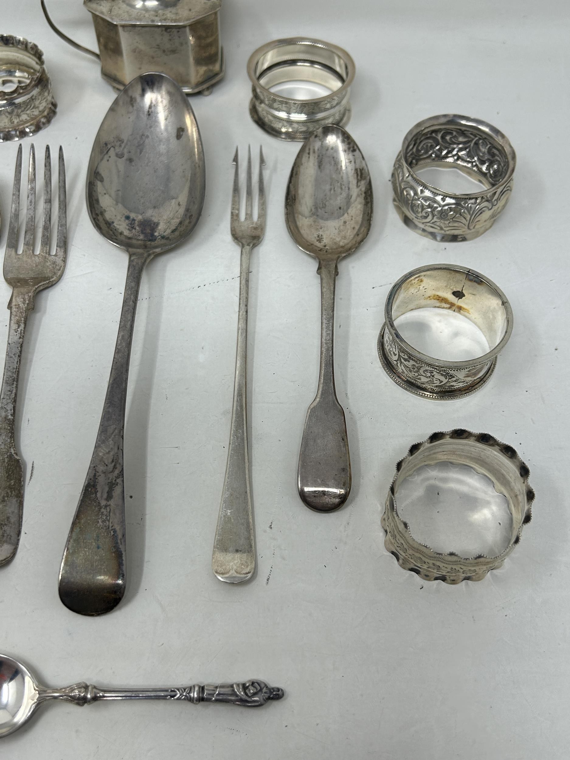 A silver Old English pattern spoon, assorted napkin rings, a mustard pot, and flatware, various - Image 3 of 7