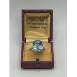 An 18ct white gold and blue stone ring, ring size M, in a vintage jewellery box stone size: 14.3