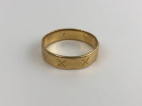 An 18ct gold wedding band, ring size T, 5g