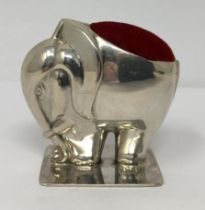 A silver coloured metal novelty pin cushion, in the form of an elephant, stamped 925 Provenance:
