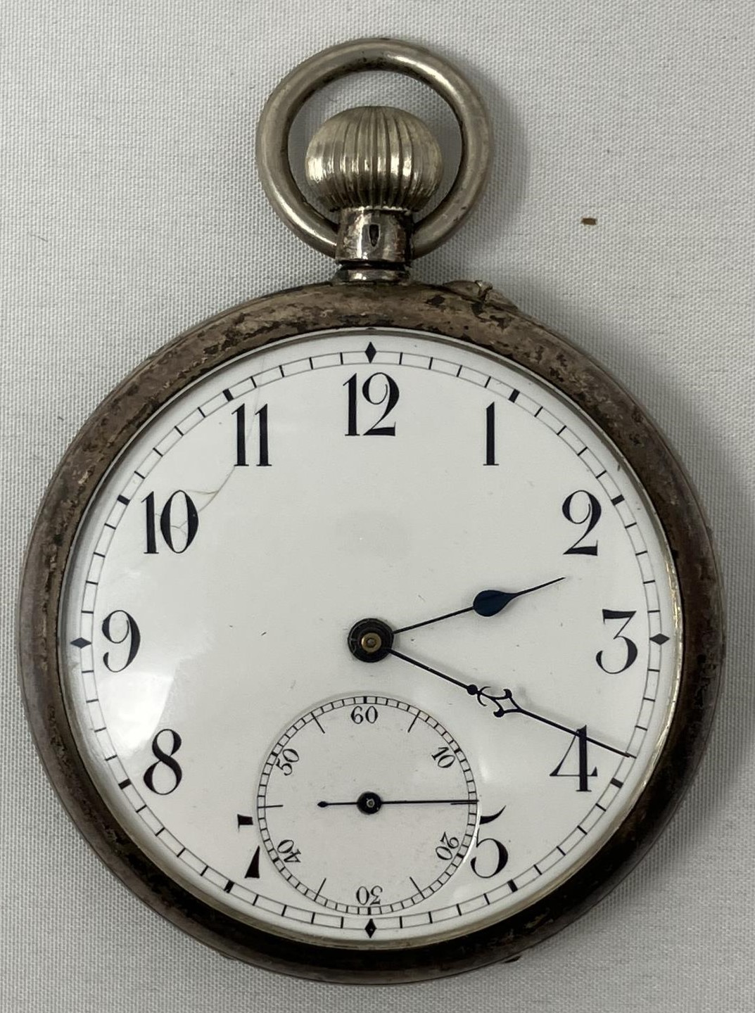 A silver coloured metal open face pocket watch