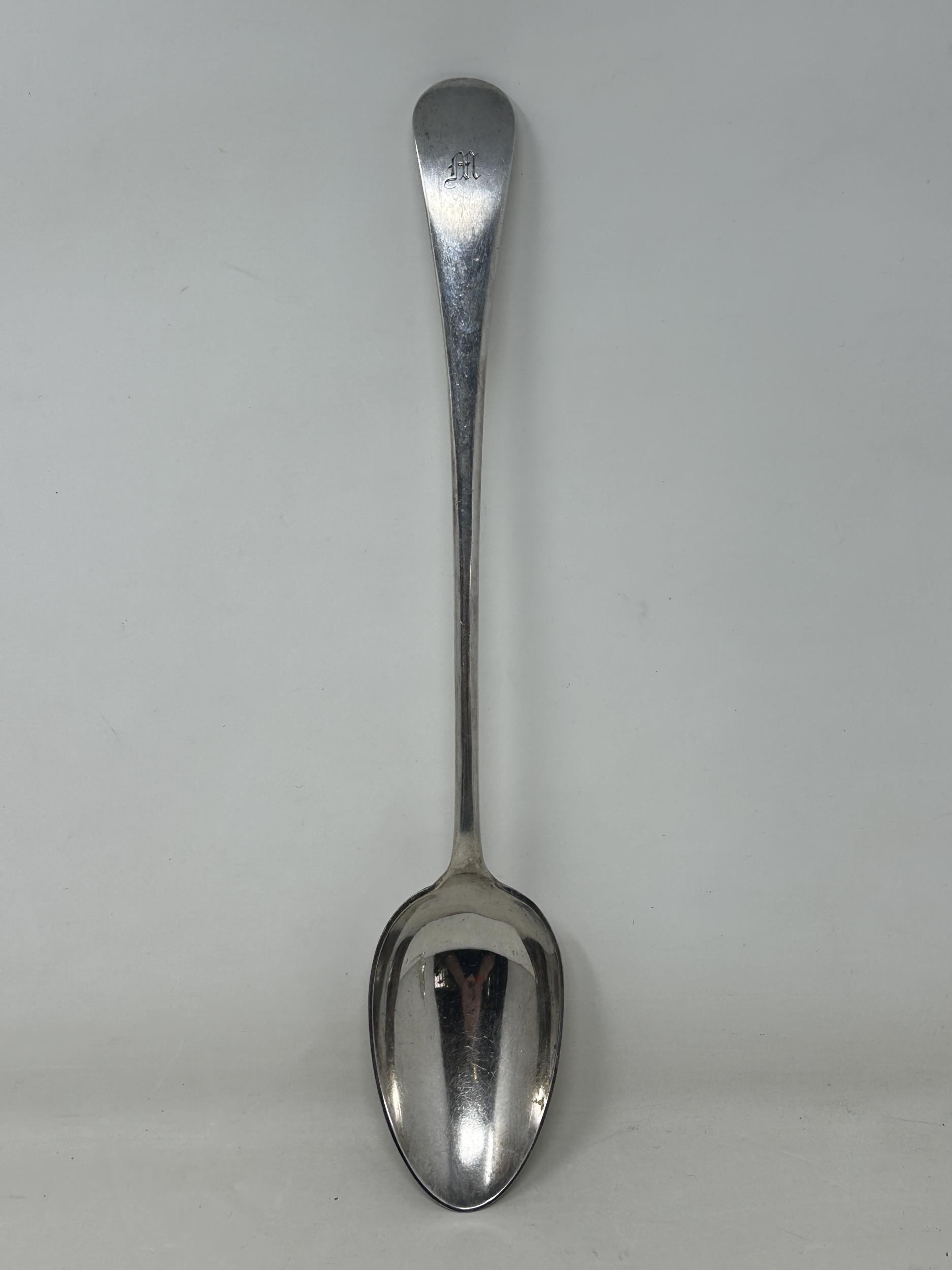 A silver plated Old English pattern gravy spoon