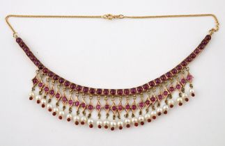 An Indian yellow coloured metal, synthetic ruby and seed pearl fringe necklace weight: 34 g all in