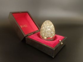 A silver gilt Easter egg, by Stuart Devlin, No 101, cased with receipt, 5.75 ozt no obvious faults