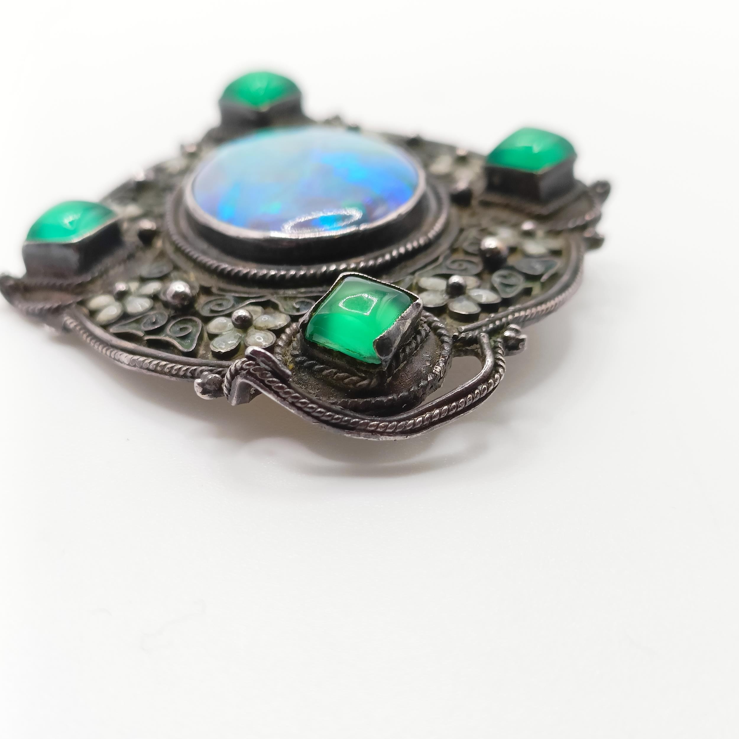 An Arts and Crafts silver coloured metal, opal, green stone and enamel brooch, by Jean Bassett - Image 5 of 5