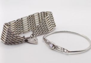 A silver bracelet, with a heart shaped padlock clasp, and a silver and purple stone bangle (2)