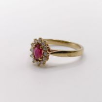 A 9ct gold, ruby and diamond cluster ring, ring size M