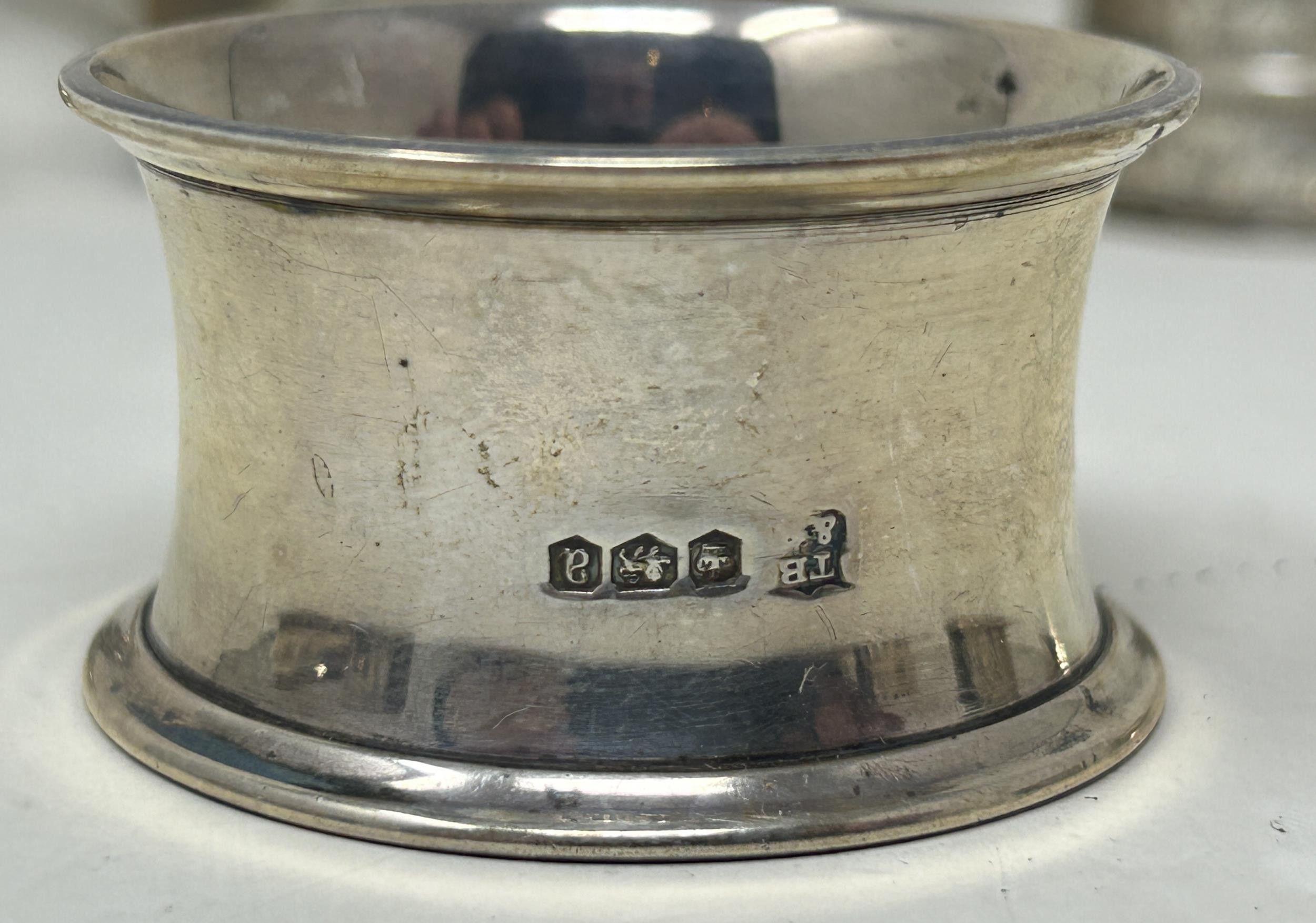 A silver Old English pattern spoon, assorted napkin rings, a mustard pot, and flatware, various - Image 6 of 7