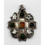 An Arts and Crafts silver coloured metal, green and amber stone pendant, by Jean Bassett, 5 cm