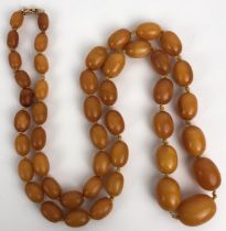 An amber coloured bead necklace 50.2 g all in