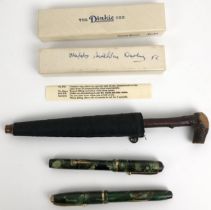 A Dinkie fountain pen, another, and a novelty quill, in the form of an umbrella
