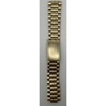 A gold plated Omega watch strap