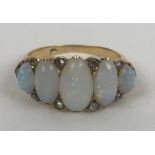 A gold and five stone opal ring, ring size N